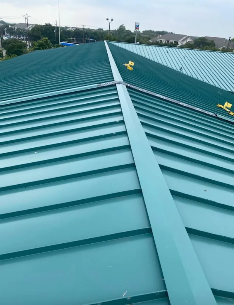 Green commercial metal roof ridge and valley for Metal Roof Repair in Fairhaven